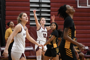 Perini hits 1,000 points in Huskies’ win